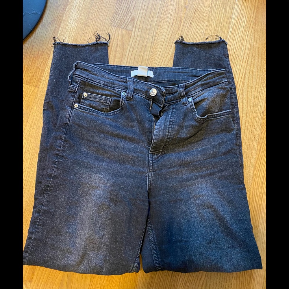 Worn black H&M high-waisted skinny jeans with frayed ankles, size 6